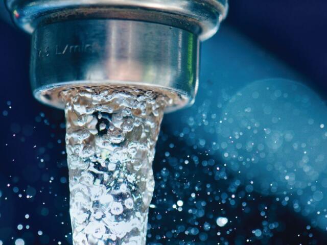 water coming out of a faucet