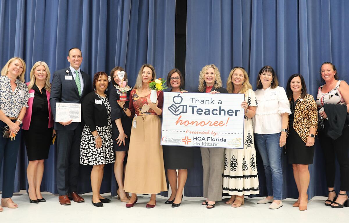 Pictured from left to right: Angela Ponder, principal, Hammett Bowen Jr. Elementary School; Meghan Magamoll, executive director, PEFMC; Alan Keesee, chief executive officer, HCA Florida Ocala Hospital; Stephanie Hill-Palmer, PEFMC board member; Erin Buss, PEFMC board member; Rebecca Koloszy, Thank a Teacher recipient; Danielle Brewer, interim superintendent, MCPS; Allison Campbell, MCPS school board member; Lori Conrad, chairwoman, MCPS school board; Julie Shealy PEFMC board member; Melissa Conner; Renae Robinson, PEFMC board member.