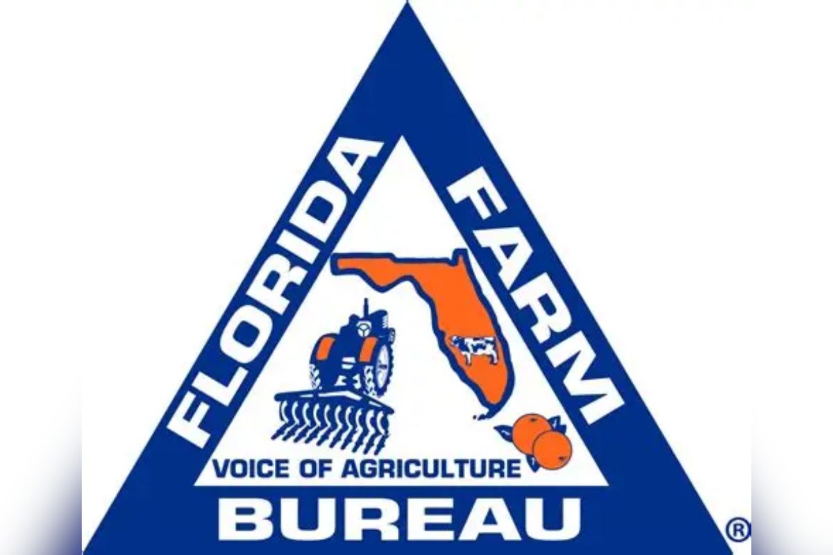 A blue triangle, with white lettering and on the inside multiple symbols, blue, white and orange in color.