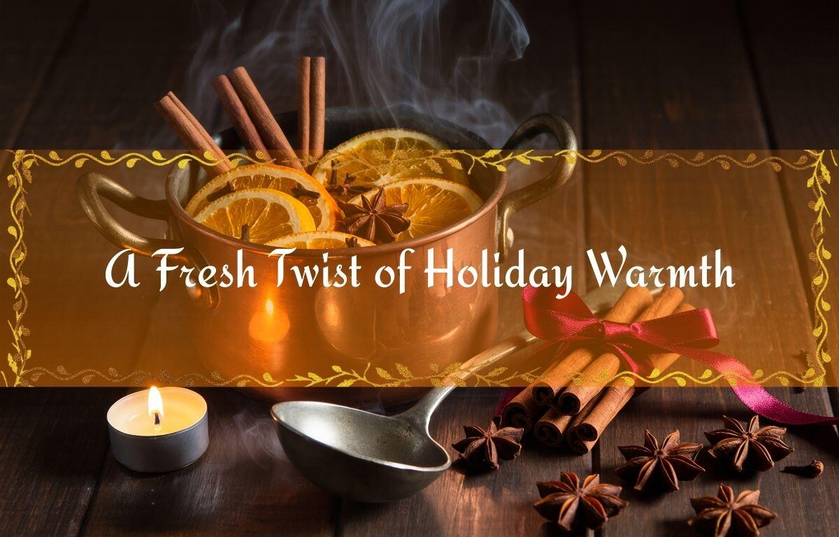 A warm holiday scene with a steaming simmer pot filled with sliced oranges, cinnamon sticks, and star anise on a wooden surface, surrounded by spices, a lit tealight candle, and a ladle, with a banner reading “A Fresh Twist of Holiday Warmth.”