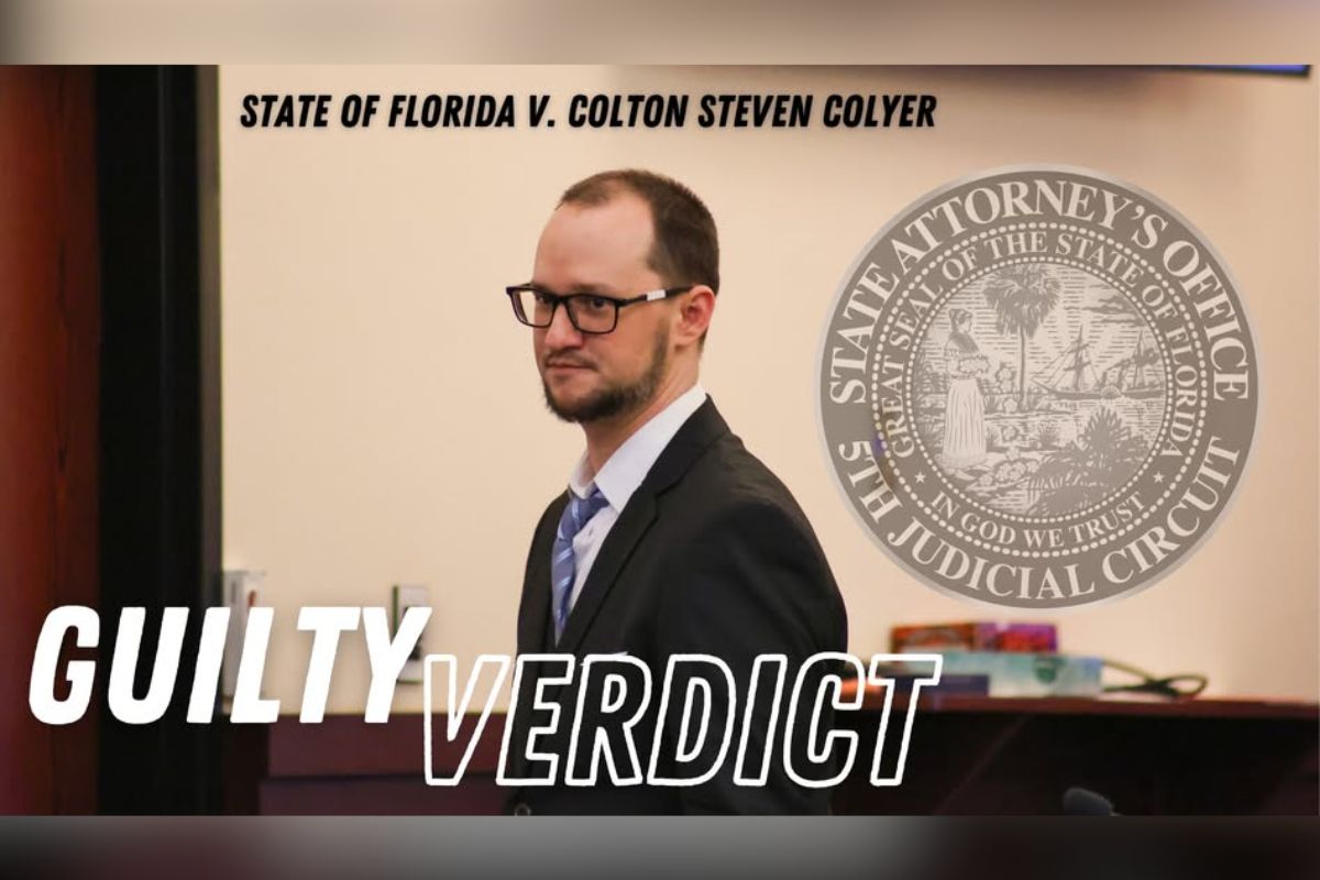 Graphics across the top and the bottom of the image, a door to the left and a dais in the background, and a well-dressed man wearing glasses.