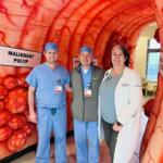 Dr. Jack Weckowski, center, is pictured with a resident physician from HCA Florida Ocala Hospital and Julie Bonnie, manager of the oncology nurse navigation team for HCA Healthcare’s North Florida Division. 