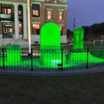 The Old Courthouse Heritage Museum Veterans Memorial lit up in green