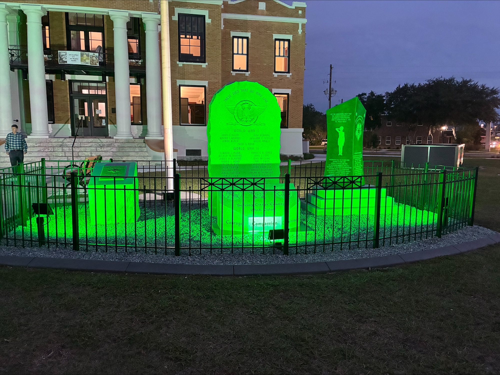 The Old Courthouse Heritage Museum Veterans Memorial lit up in green