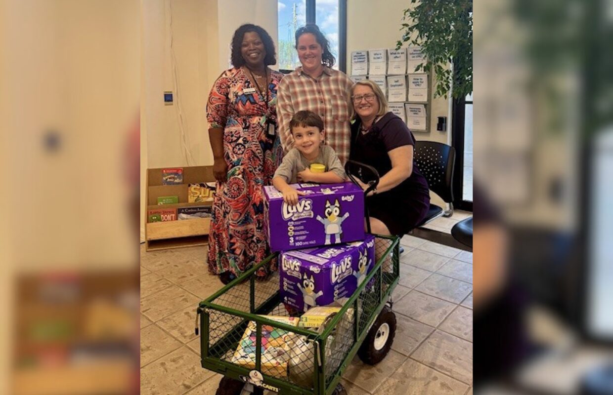 Lucas donation w-CEO: Early Learning Coalition of Marion County CEO LaTrisha Sims, Tayler Croom-Perez (Lucas’s mom), Parent Education Coordinator Ruth Velez, and Lucas Perez with the donations Lucas bought to help babies