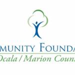 The Community Foundation Ocala/Marion County logo. An abstract figure of a happy person with both hands up also serves as the trunk of a tree. Three green semi circles around the person's torso create the tree shape.