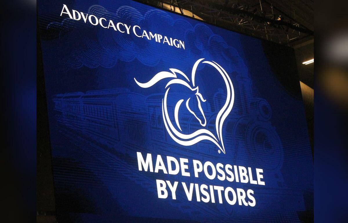 White lettering on a blue background, with the image of a horse's head and a heart, with white lettering underneath.