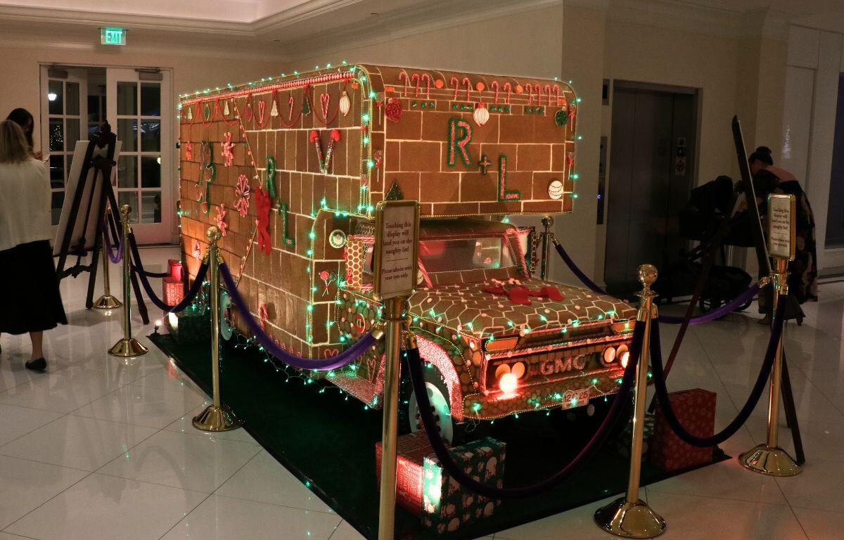 A gingerbread-style vehicle decorated with candy-themed props.