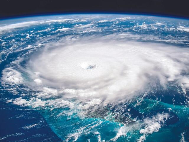 A colored satellite image of hurricane over water.