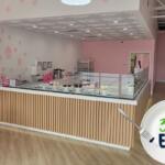 A dessert counter offering cupcakes, ice cream and chocolates dominate the background with a logo reading, "352Eats" in the foreground.