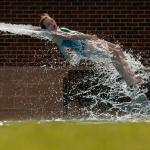a girl coming off a waterslide