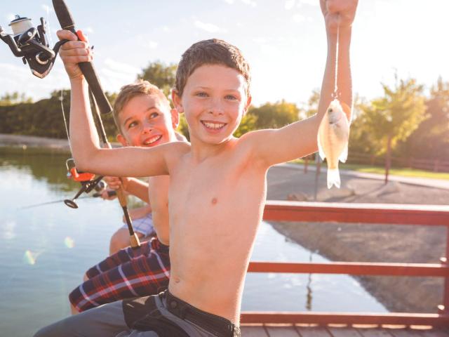 fishing kids catch a small panfish