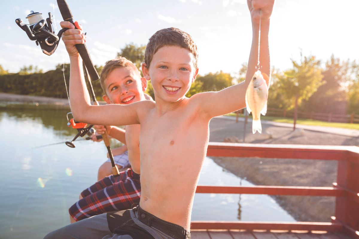 fishing kids catch a small panfish