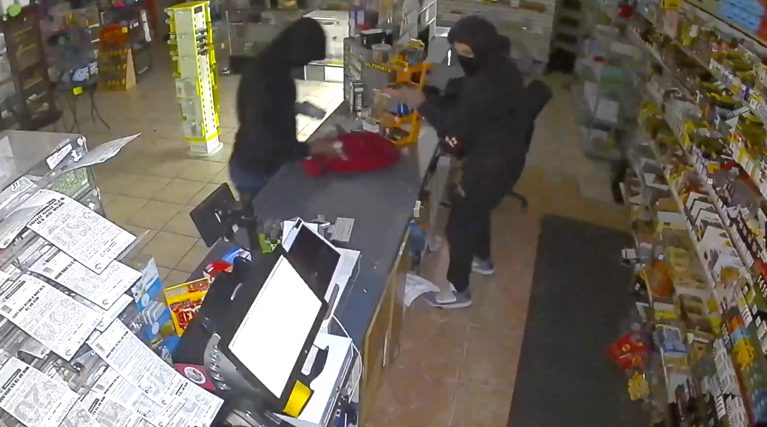 screenshot from security video showing juveniles burglarizing a business