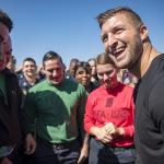 Tim Tebow interacts with Sailors on the flight deck of Nimitz-class aircraft carrier USS Carl Vinson (CVN 70) during a visit to the ship.