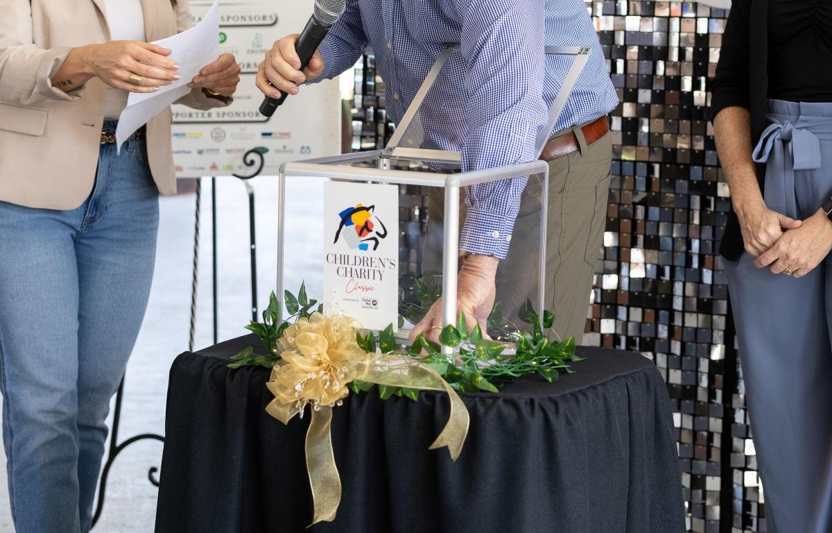 random selections being made at the United Way Marion County's Children's Charity Classic Pairing Party