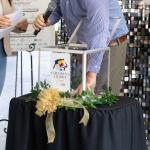 random selections being made at the United Way Marion County's Children's Charity Classic Pairing Party