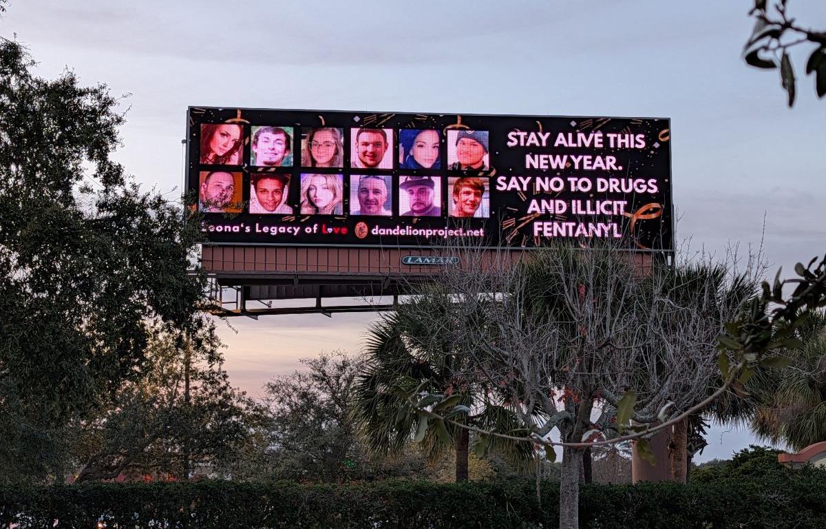 a billboard featuring lives lost to addiction