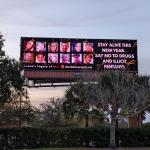 a billboard featuring lives lost to addiction