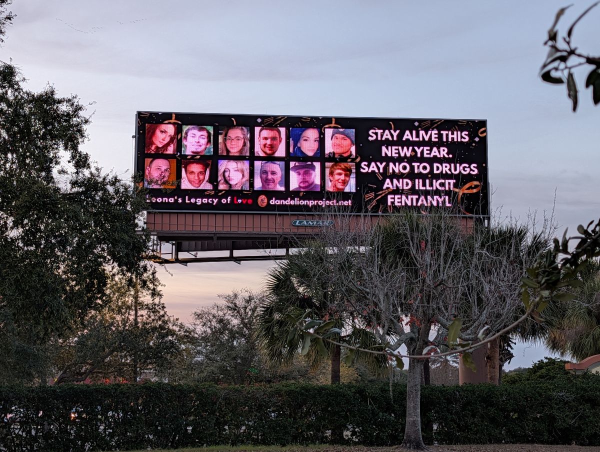 a billboard featuring lives lost to addiction