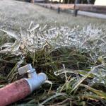 cold weather causes water running from a hose to freeze