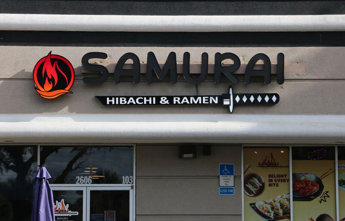 Exterior sign and entrance of Samurai Hibachi & Ramen.