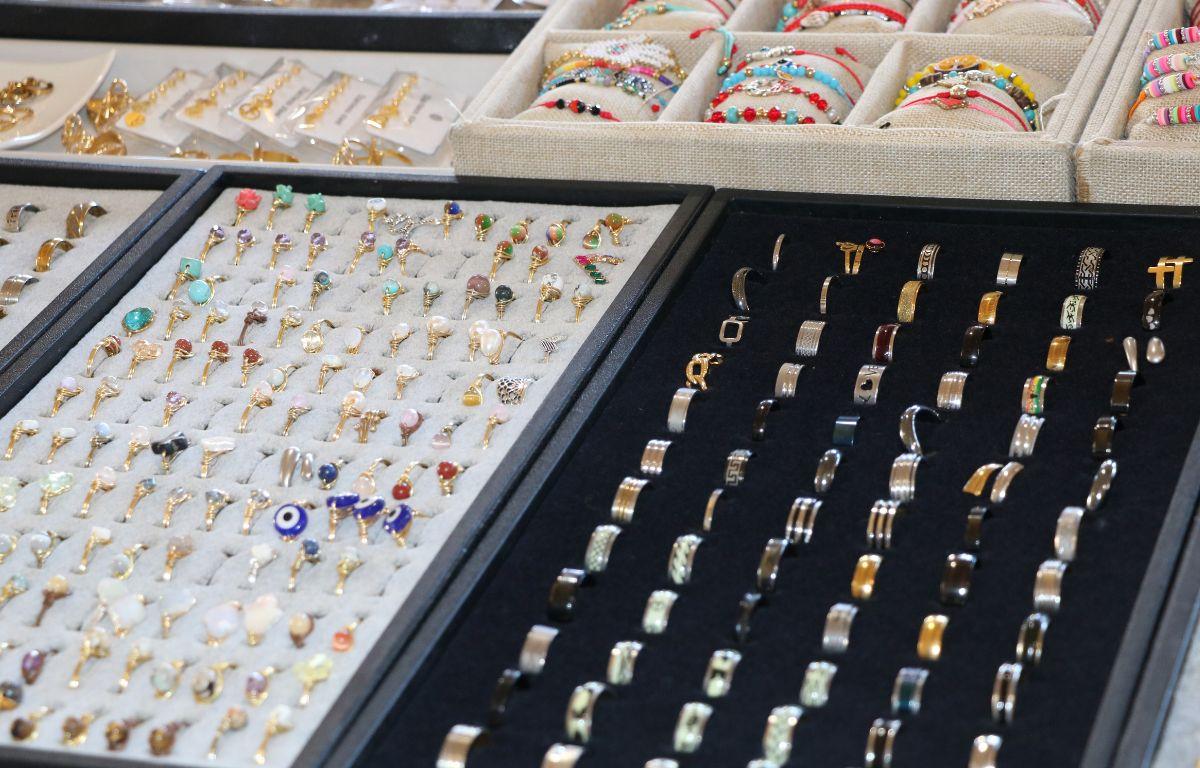 Jewelry is displayed in boxes with velvet linings.