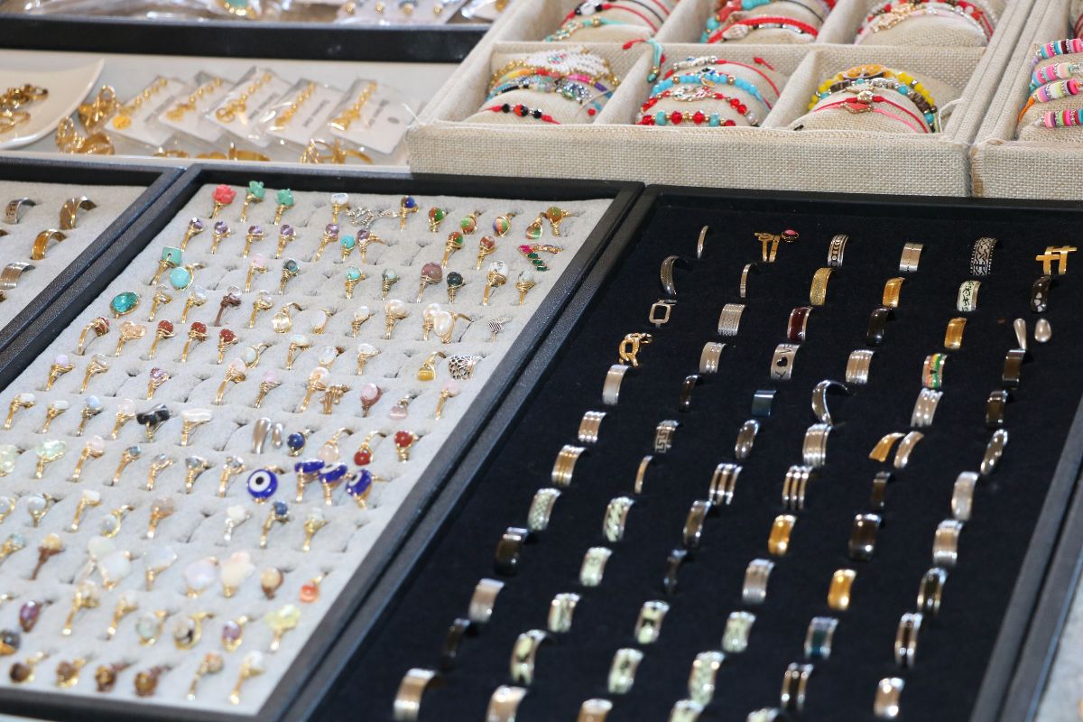 Jewelry is displayed in boxes with velvet linings.