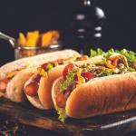 three hot dogs in a professional culinary photo