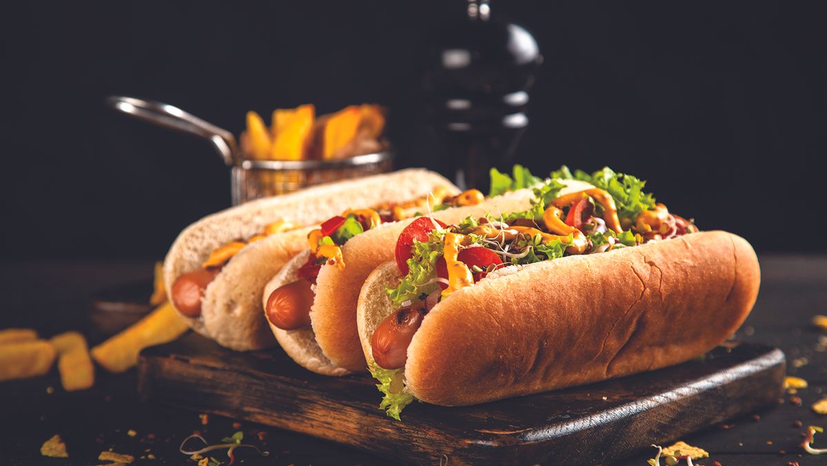 three hot dogs in a professional culinary photo