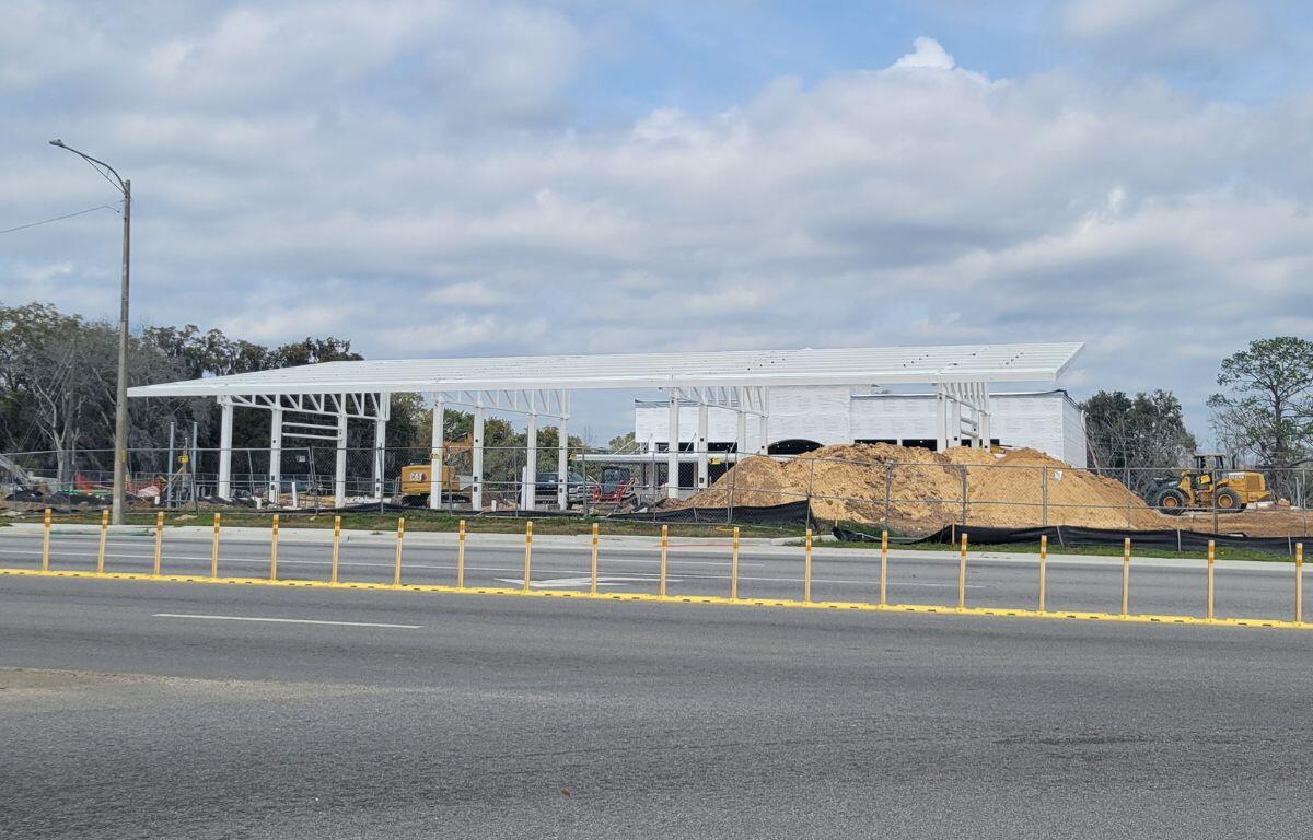 A construction site with supports for a gas station on-site.