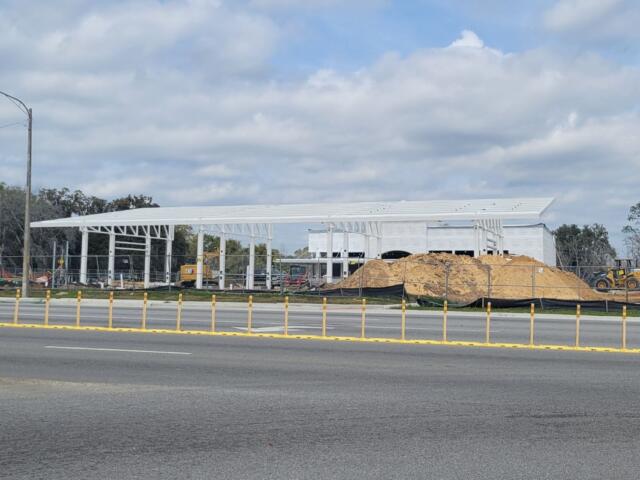 A construction site with supports for a gas station on-site.