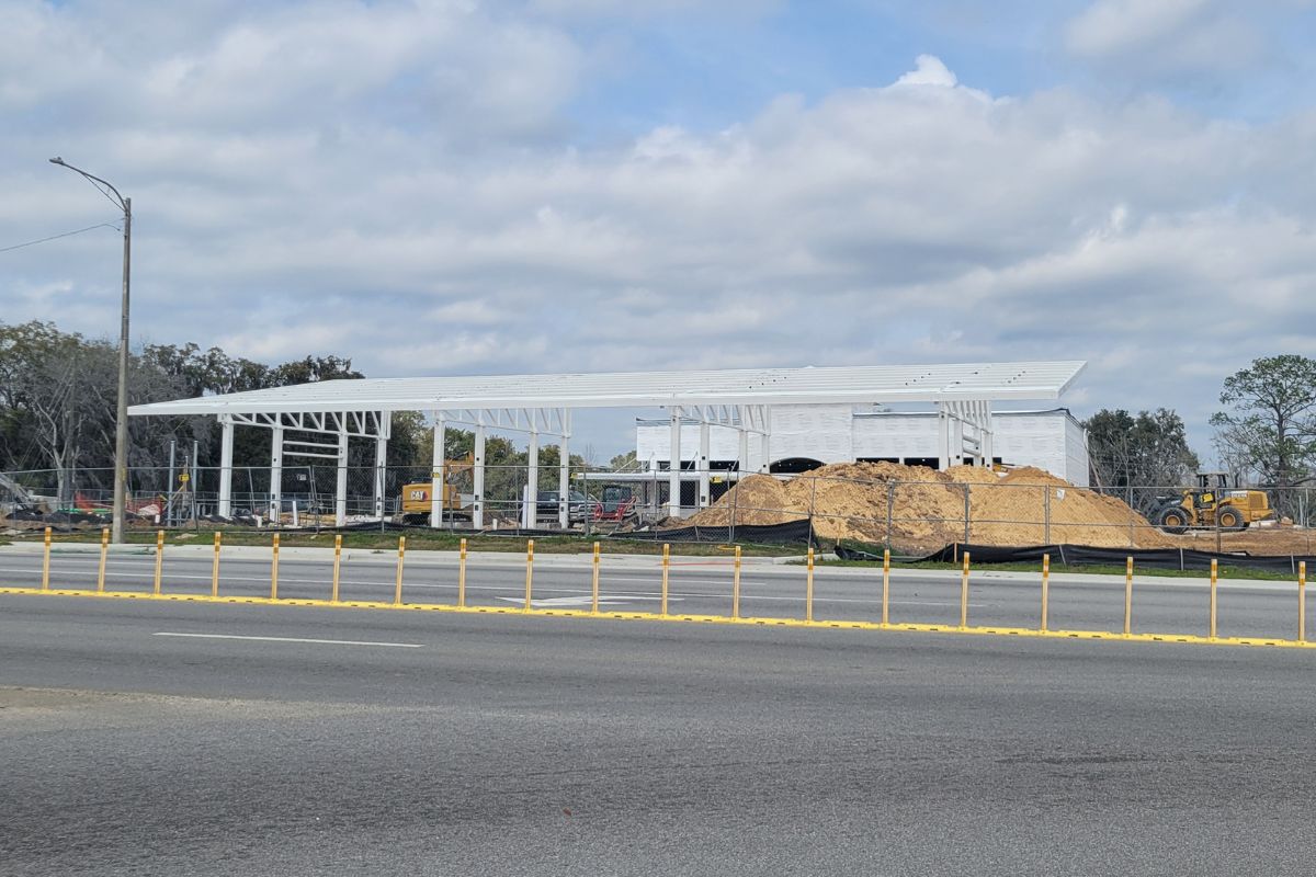 A construction site with supports for a gas station on-site.
