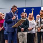 County Commissioner Matt McClain reads the Engineers Week proclamation into the record during the Feb. 17 county commission meeting, and is joined on stage by engineers across multiple county departments.