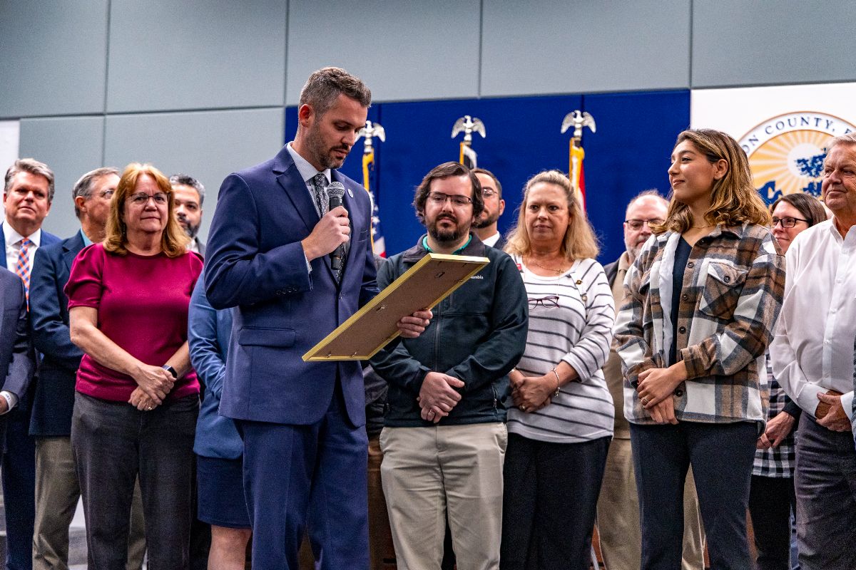 County Commissioner Matt McClain reads the Engineers Week proclamation into the record during the Feb. 17 county commission meeting, and is joined on stage by engineers across multiple county departments.