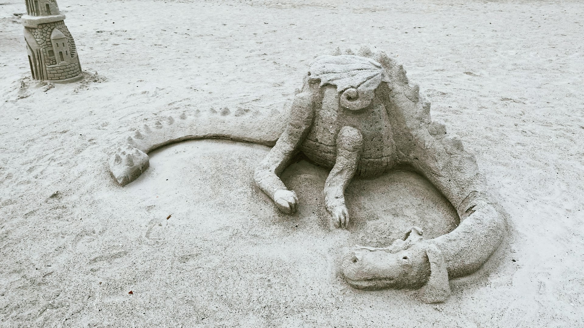sand sculpture of a dragon to illustrate new Ocala sand and sun festival