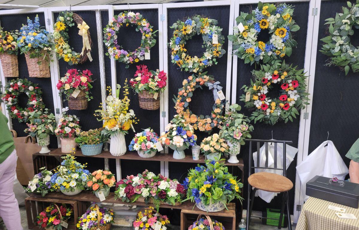 Display of decorative items arranged vertically on a rack or stand.