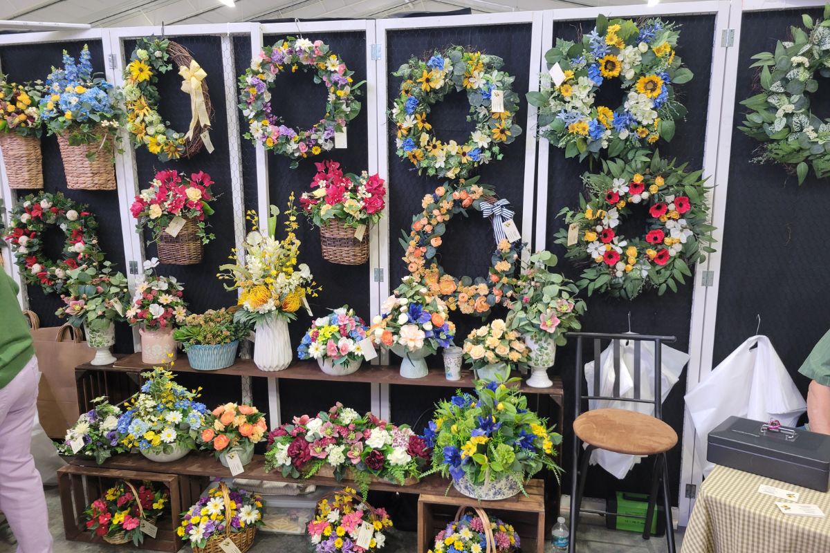 Display of decorative items arranged vertically on a rack or stand.