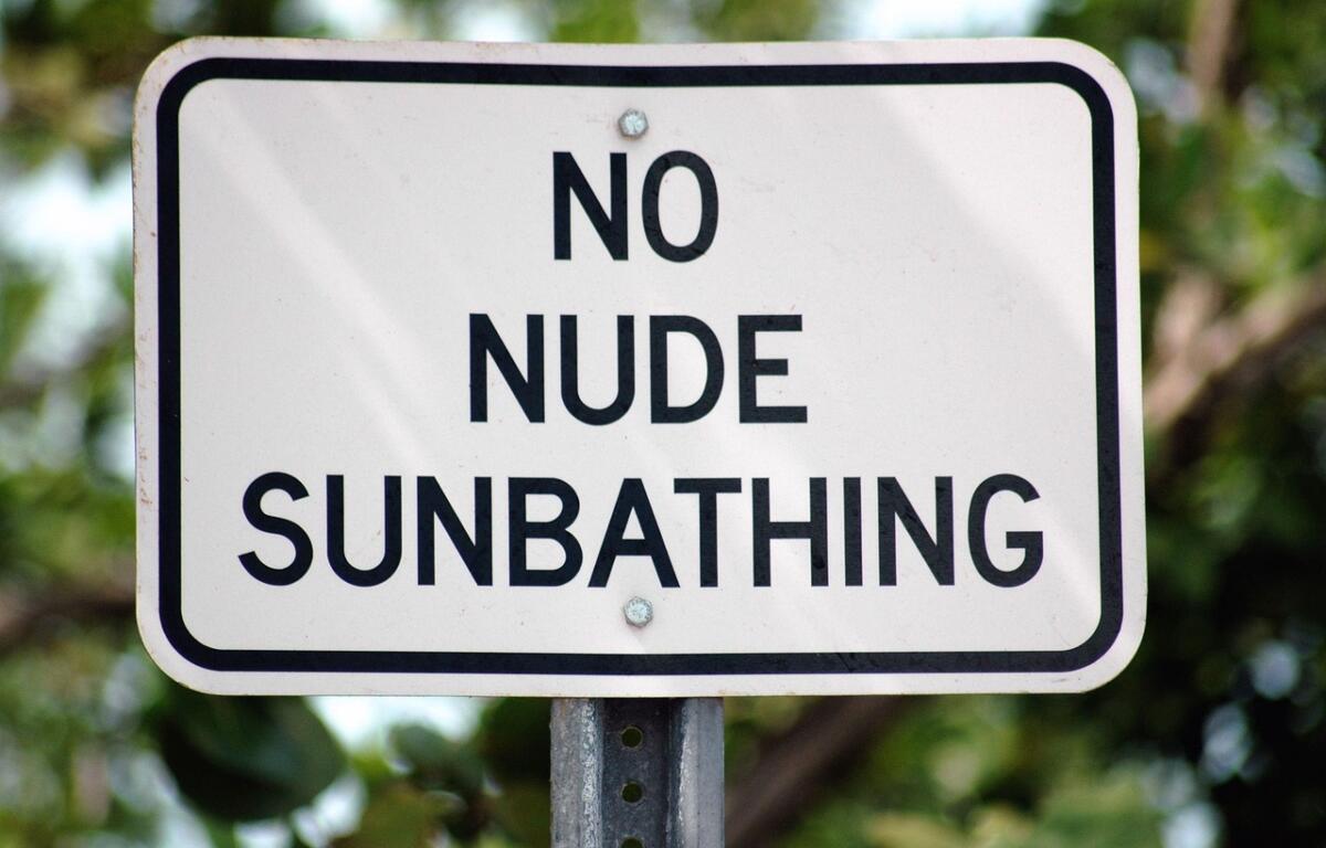 no nude sunbathing sign naturist community american association for nude recreation