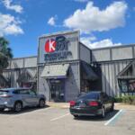 A gray storefront for KPOT Korean BBQ and Hot Pot.