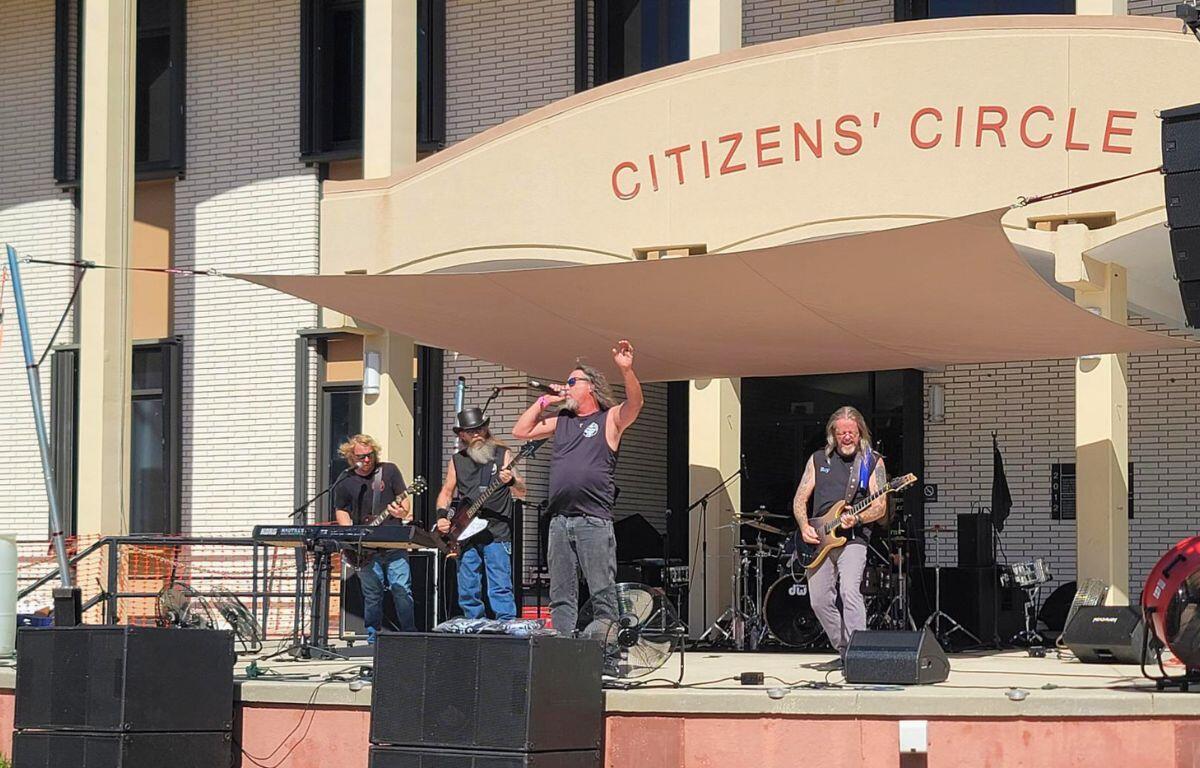 A band performs live music on a stage.
