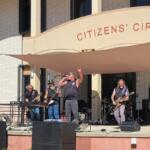 A band performs live music on a stage.