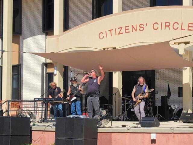 A band performs live music on a stage.