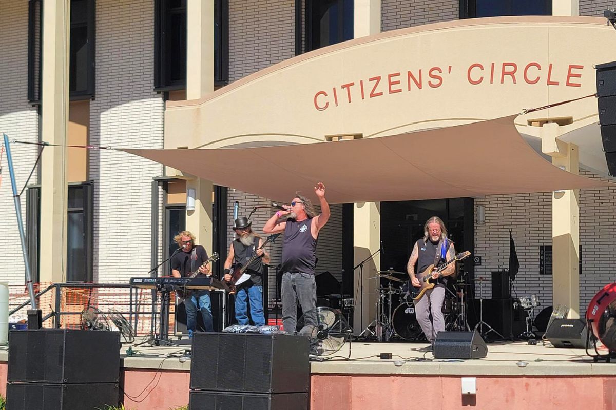 A band performs live music on a stage.