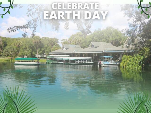 A view of a loading dock with boats floating on clear water in a wooded area sits on top of a green background. In the foreground is white text that reads, "Celebrate Earth Day." Graphics of vines and palm leaves.