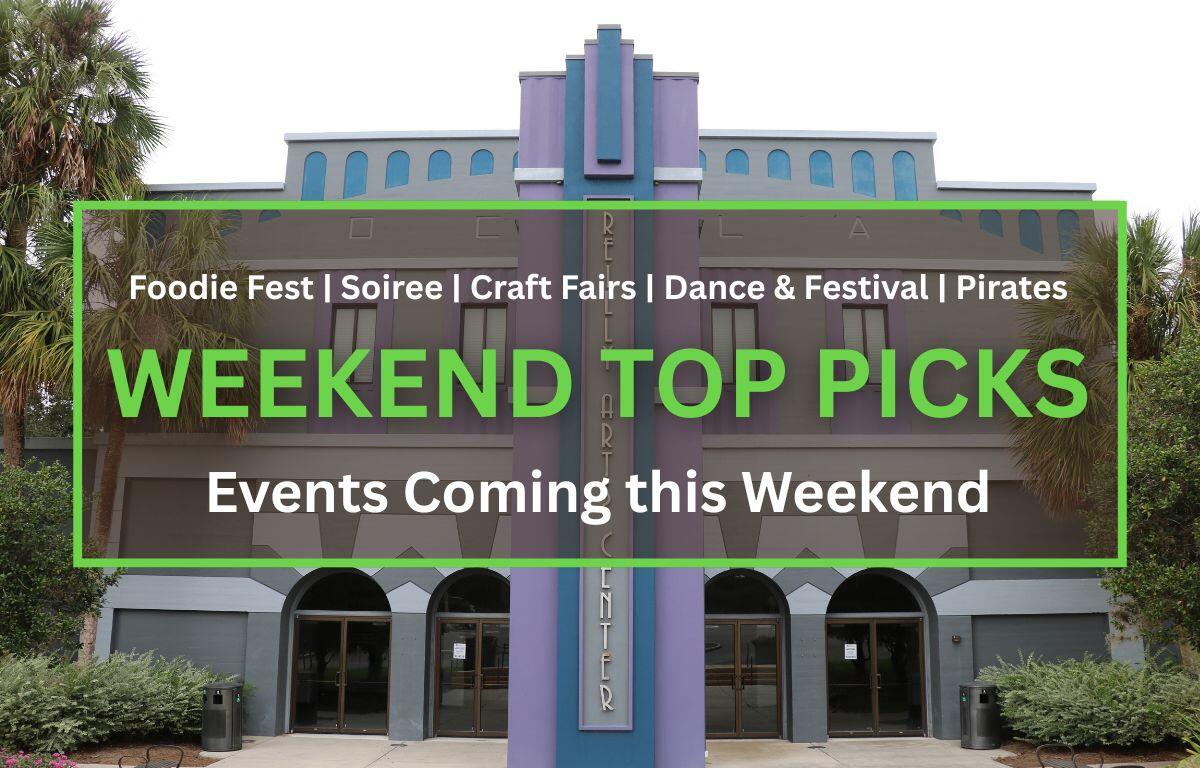 Front view of the Reilly Arts Center, featuring a gray and purple art deco facade with arched doorways and palm trees.