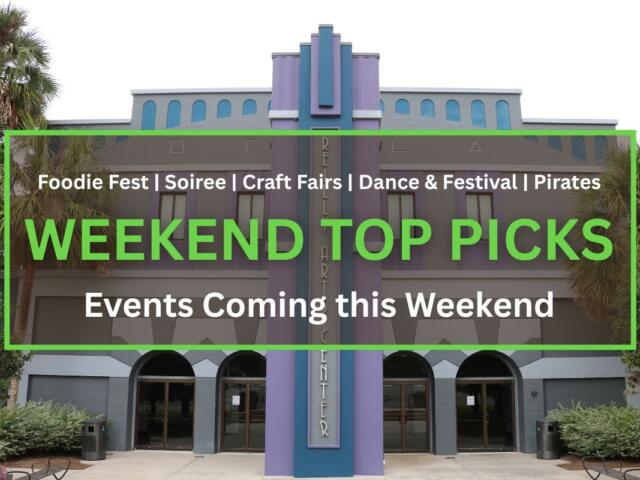 Front view of the Reilly Arts Center, featuring a gray and purple art deco facade with arched doorways and palm trees.