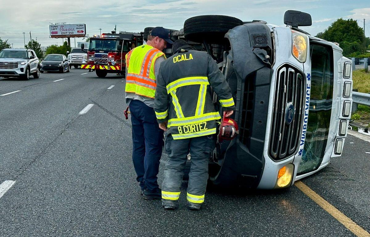 Ocala Fire Rescue officials respond to the scene of a three-vehicle crash involving an overturned ambulance.