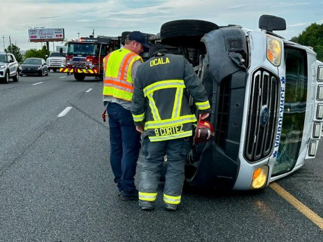 Ocala Fire Rescue officials respond to the scene of a three-vehicle crash involving an overturned ambulance.