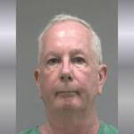 A mugshot of an older man in a green jumpsuit.